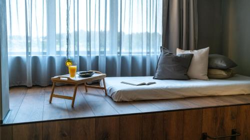 Ένα ή περισσότερα κρεβάτια σε δωμάτιο στο Puro Dão Hotel & Spa