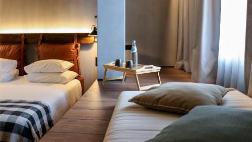 Ένα ή περισσότερα κρεβάτια σε δωμάτιο στο Puro Dão Hotel & Spa
