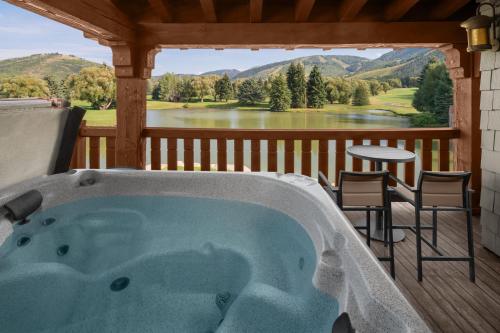 a jacuzzi tub on a deck with a view at Hotel Park City, Autograph Collection in Park City