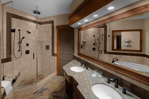 a bathroom with two sinks and a shower and a tub at Hotel Park City, Autograph Collection in Park City