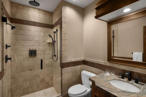 a bathroom with a shower and a toilet and a sink at Hotel Park City, Autograph Collection in Park City