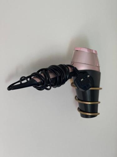a flashlight hanging from a wall at Private Bedroom in Unique Luxury House, Salford, Manchester in Manchester