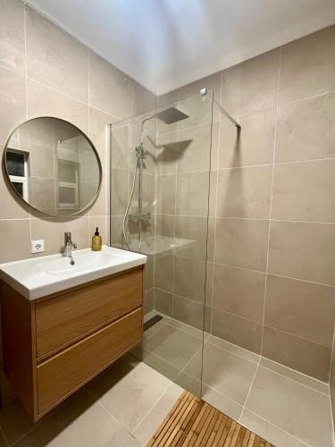 a bathroom with a sink and a shower at Charming Salema in Salema