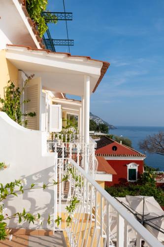 a white balcony with a view of a house at Hotel Marincanto in Positano