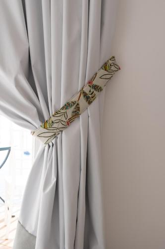 a white curtain with a leaf pattern on it at Hotel Marincanto in Positano