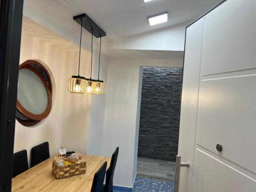 a dining room with a table and a mirror at Pompei Sunday Estate Exclusive Apartaments in Pompei