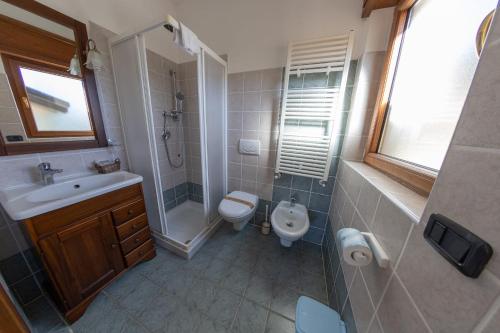 a bathroom with a sink and a toilet and a shower at River Hotel in Castel di Sangro