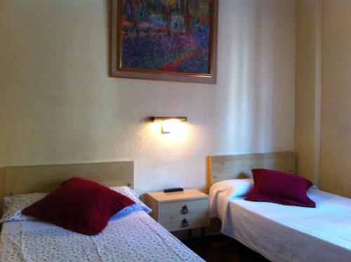 Postel nebo postele na pokoji v ubytování Hostal Suárez