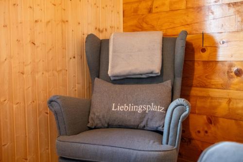 a chair with a towel on top of it at Chalet Daheim - Ferienwohnung OG in Reckingen - Gluringen