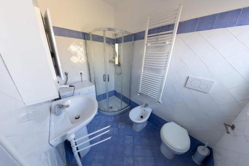 a bathroom with a sink and a toilet and a shower at River Hotel in Castel di Sangro