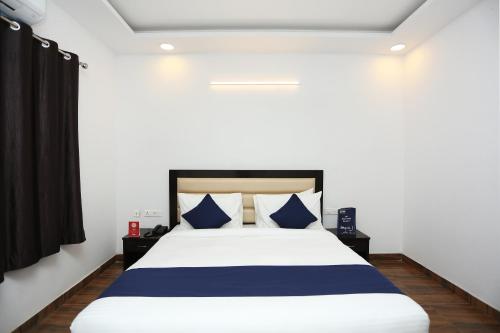 Ένα ή περισσότερα κρεβάτια σε δωμάτιο στο Collection O The King's Heritage Plaza Sohna Road