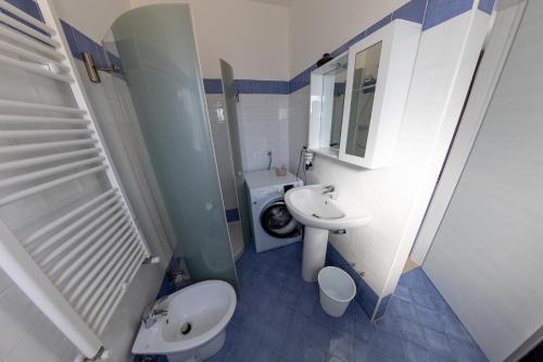a bathroom with a toilet and a sink at River Hotel in Castel di Sangro
