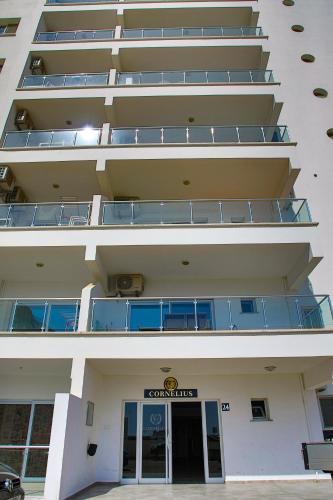 an external view of a building with balconies at Spacious One Bedroom Apartment in Caesar Resort & SPA, Long Beach in Perivolia tou Trikomou