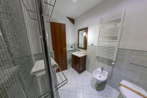 a bathroom with a sink and a toilet and a shower at River Hotel in Castel di Sangro