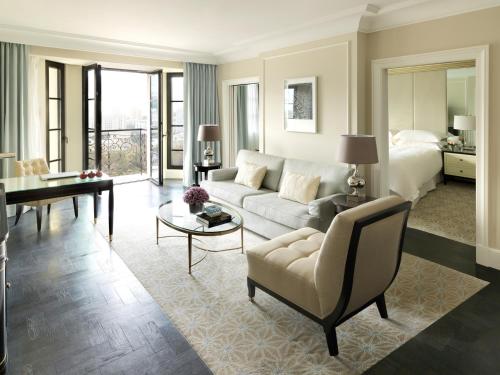 a living room with a couch and a bed at Four Seasons Hotel Baku in Baku