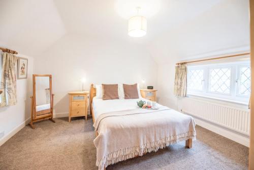 En eller flere senge i et værelse på Ann Page Cottage, Aldeburgh