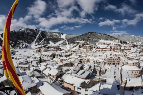 a view of a city covered in snow at L'Elan in Les Angles