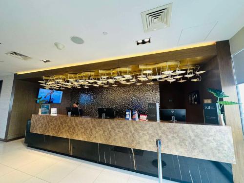 a lobby of a hotel with a reception counter at Hotel Apartment Suite near Makati in Manila