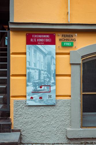 a sign on the side of a building at Alte Konditorei in Lindau