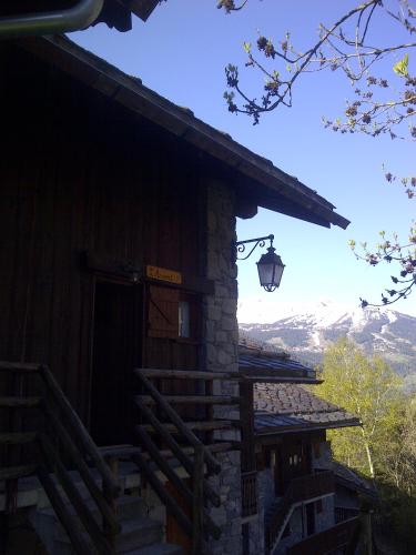 a building with a light on the side of it at L'arpont in Champagny-en-Vanoise