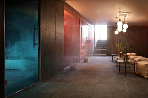 a hallway with a table and chairs in a building at Sheraton Zagreb Hotel in Zagreb