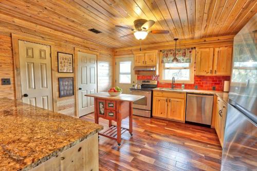 a kitchen with wooden cabinets and a wooden floor at Fox Run Ridge in Wimberley