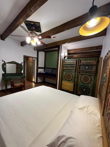 a bedroom with a bed and a room with a table at Saint Johns Hill Boutique Ephesus in Selcuk