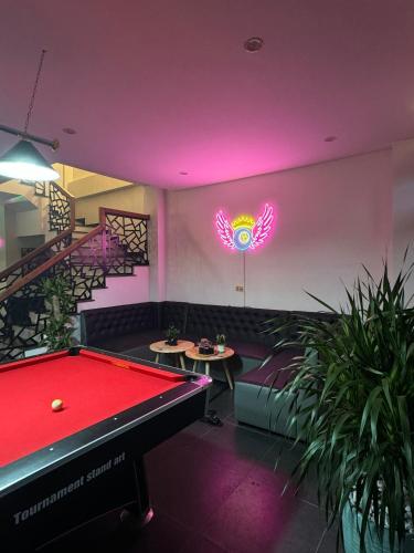 a pool table in a room with a ping pong ball at Liverpool House Mộc Châu in Mộc Châu