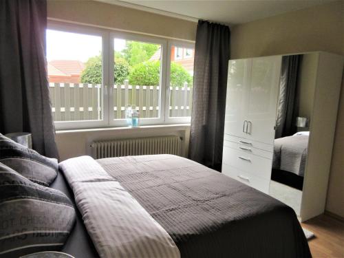 Postel nebo postele na pokoji v ubytování Schöne Ferienwohnung in Vrees