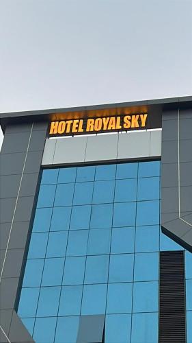 a hotel royal sky sign on the side of a building at Hotel Royal Sky in Morbi