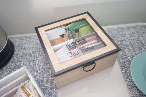 a wooden box with a picture in it on a table at L'isola di Kalyta in Lido di Ostia