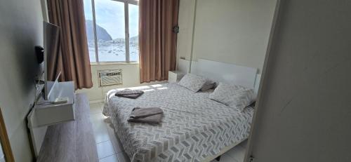 Ένα ή περισσότερα κρεβάτια σε δωμάτιο στο Botafogo - Melhor Vista