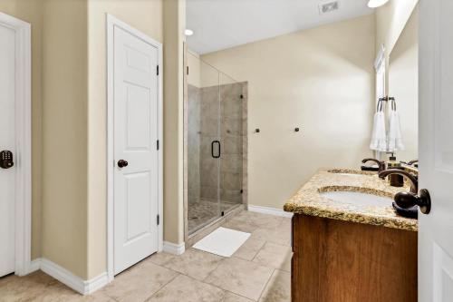 a bathroom with a sink and a shower at Copper Canyon Hideaway in Canyon Lake