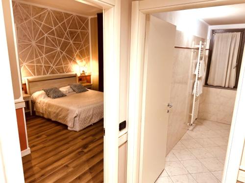 Ένα ή περισσότερα κρεβάτια σε δωμάτιο στο Hotel Malpensa INN Aereoporto