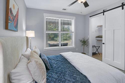 a bedroom with a bed and a ceiling fan at Gatlin Getaway in Dripping Springs