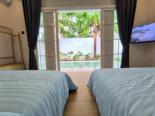 Ένα ή περισσότερα κρεβάτια σε δωμάτιο στο Americana Villa Private Pool