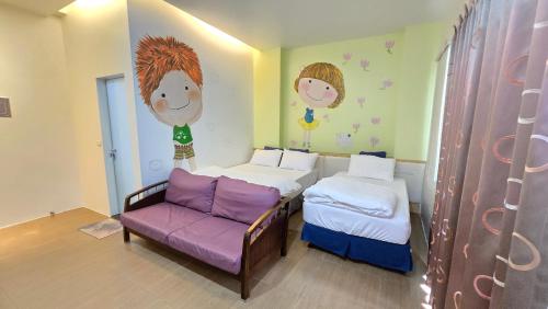 a small bedroom with two beds and a couch at ChaoPingJia Fengge Guesthouse in Wujie