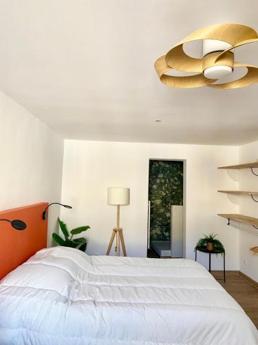 Voodi või voodid majutusasutuse Beau T3 Spacieux, lumineux et central toas