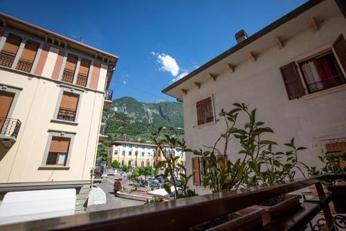 a view of a street between two buildings at Hotel Lago Di Garda in Malcesine