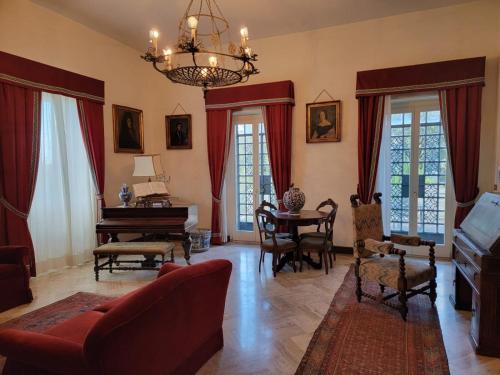a living room with a couch and a piano at Villa Donna Anna in Assisi