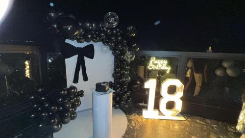 a table with a sign that says and balloons at Hotel Primeland Pinjore in Pinjaur