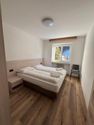 Postel nebo postele na pokoji v ubytování Cèsa Carlotta by AMA Val di Fassa