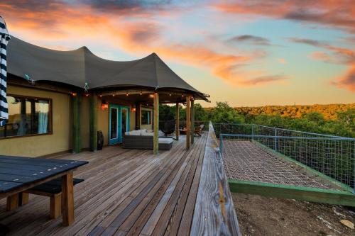 a deck with a tent on top of a house at Mystic Hills Ranch in Fischer