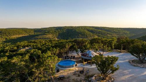 an aerial view of a house in the middle of a forest at Mystic Hills Ranch in Fischer