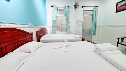Katil atau katil-katil dalam bilik di Quoc Dinh Guest House