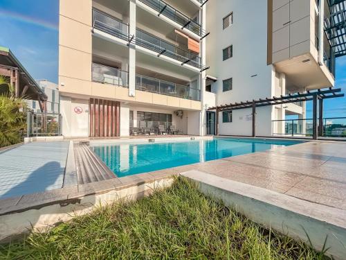 a swimming pool in the middle of a building at Appartement Bleu d'Azur in Fort-de-France