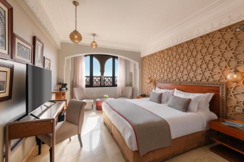 Una cama o camas en una habitación de Hivernage Hotel & Spa