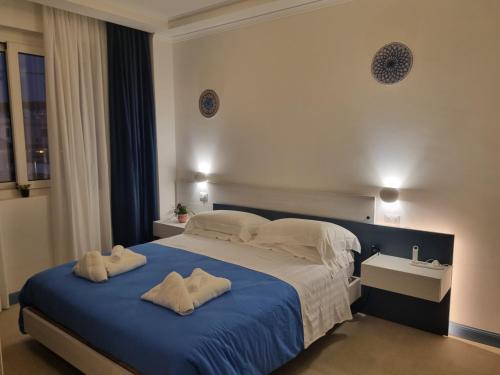 Postel nebo postele na pokoji v ubytování B&B Naiadi Anzio