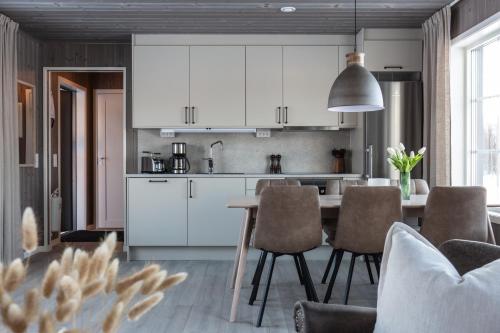 Kuchyň nebo kuchyňský kout v ubytování Skarvrusäterns Fjällby - Tänndalen