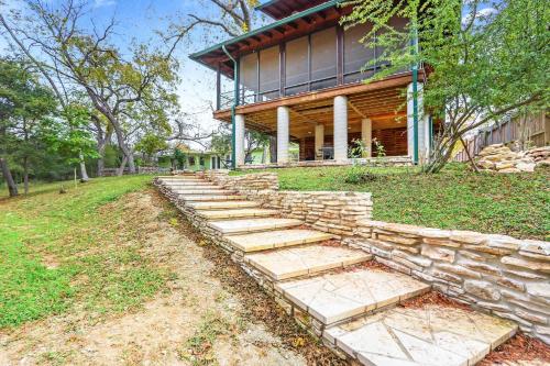 a stone stairway leading up to a house at Cypress Star in Wimberley